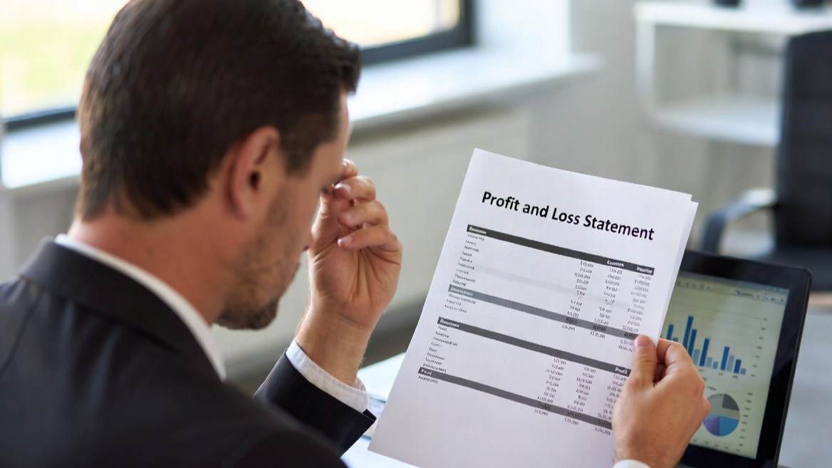 Executive reading profit and loss statement